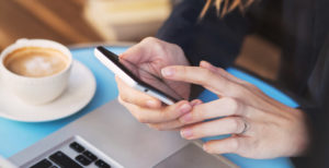 industry new woman with phone and coffee cup